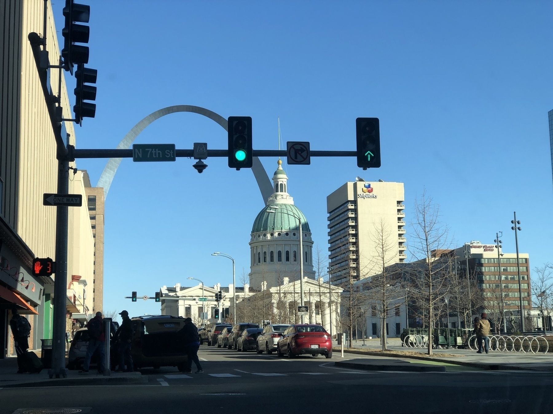 the Gateway Arch and Old Courthouse parts of the Jefferson National Expansion Memorial in downtown St Louis, Missouri as seen from the corner of Chestnut and 7th