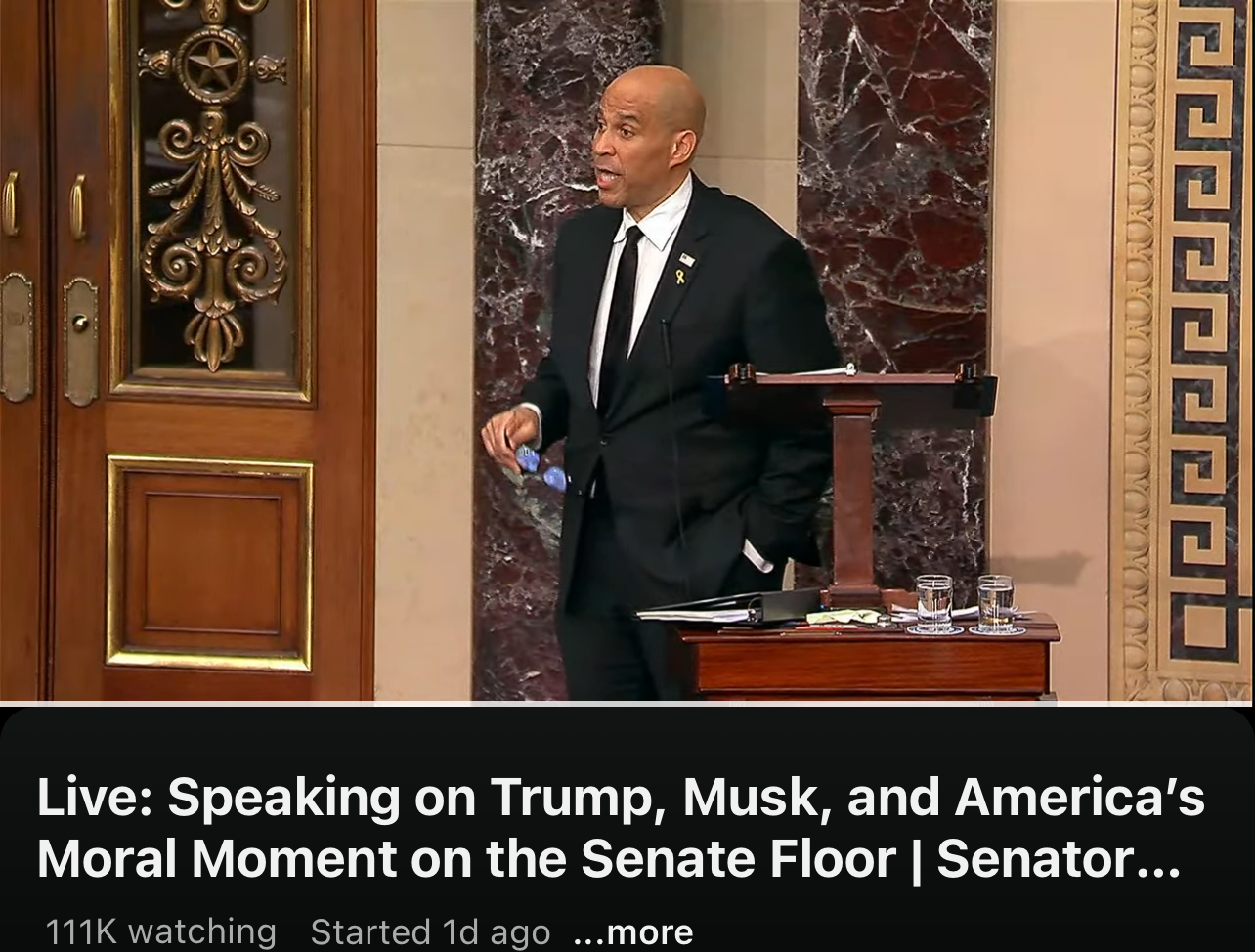  A person is standing and speaking on the Senate floor, with a headline about various topics being discussed.