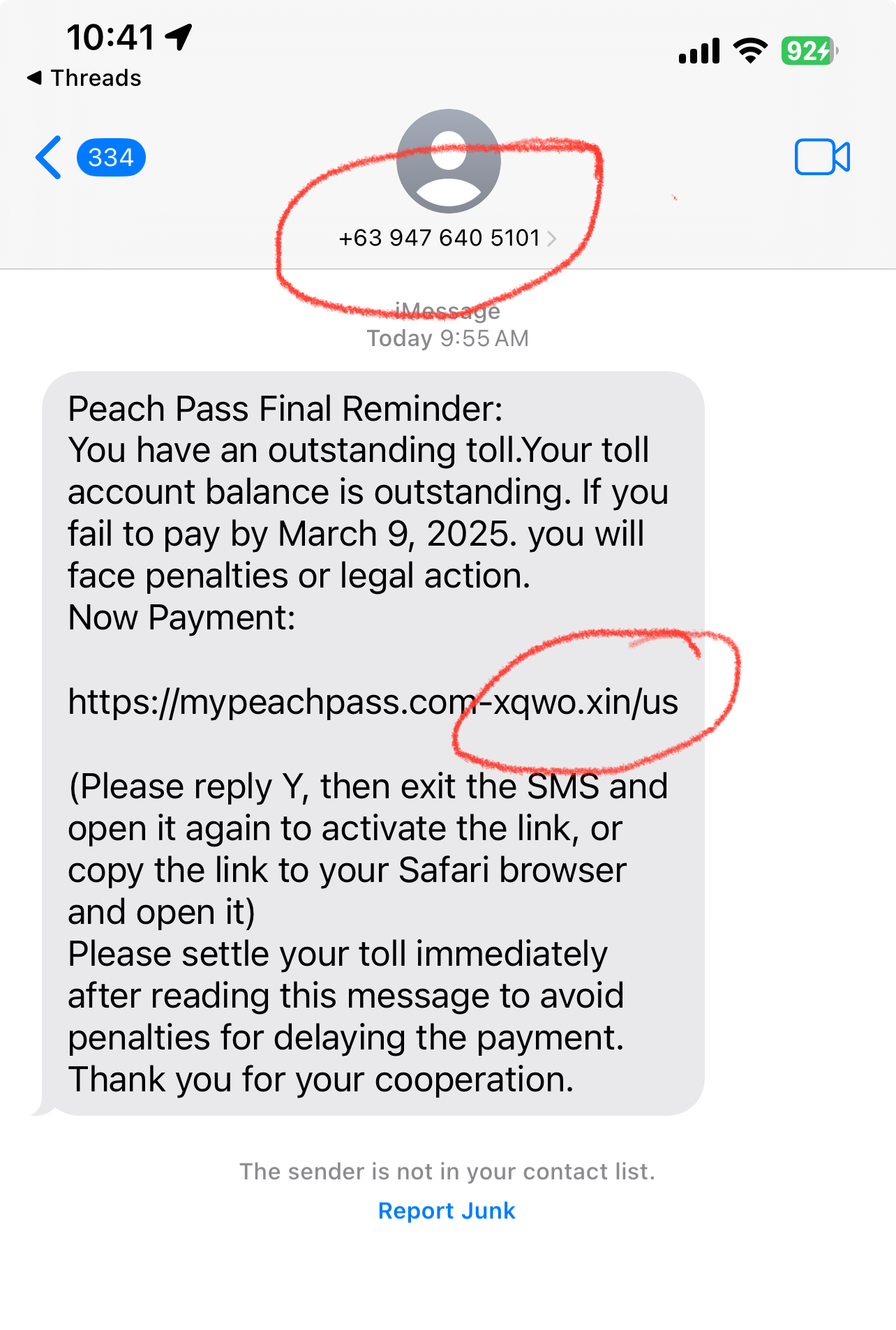 A text message claiming an outstanding toll payment is due with a suspicious phone number and link.